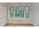 Bright room with a large window providing a view of the trees at 315 N Fayette Dr, Fayetteville, GA 30214