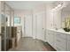 Bathroom features a tiled shower, soaking tub, and a double sink vanity at 383 Crestbrook Ln, Dallas, GA 30157