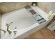 Close up on a soaking tub with a caddy and candles next to it at 383 Crestbrook Ln, Dallas, GA 30157
