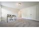 Bright room with neutral paint, plush carpeting, and desk space for the perfect office-bedroom set-up at 383 Crestbrook Ln, Dallas, GA 30157
