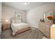 Cozy bedroom boasts a comfortable bed, soft lighting, and a stylish dresser at 383 Crestbrook Ln, Dallas, GA 30157