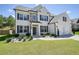 Beautiful two-story home with a manicured lawn, a two-car garage, and a classic brick facade at 383 Crestbrook Ln, Dallas, GA 30157