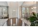 Bright foyer with soaring ceilings, hardwood floors, a large window and dining area adjacent to the entrance at 383 Crestbrook Ln, Dallas, GA 30157