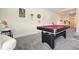 Game room featuring a red pool table, dart board, bar stools and wall art at 383 Crestbrook Ln, Dallas, GA 30157