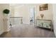 Hallway featuring a small foyer table and a doorway leading to a bedroom at 383 Crestbrook Ln, Dallas, GA 30157