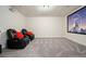 Home theater featuring a projection screen, projector, plush carpet and reclining chairs at 383 Crestbrook Ln, Dallas, GA 30157