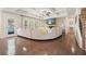 Bright and open living room featuring a large sofa, coffered ceiling, hardwood floors, and access to outdoor space at 383 Crestbrook Ln, Dallas, GA 30157
