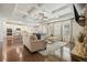 Open concept living space with a kitchen, dining area, and living room featuring a stone fireplace at 383 Crestbrook Ln, Dallas, GA 30157