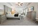 Elegant main bedroom with tray ceiling, lots of natural light, sitting area, and plenty of space at 383 Crestbrook Ln, Dallas, GA 30157