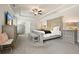 Bright main bedroom featuring a stylish bed, neutral decor and recessed lighting at 383 Crestbrook Ln, Dallas, GA 30157