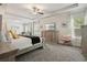 Spacious main bedroom with tray ceiling, lots of natural light, sitting area, and plenty of space at 383 Crestbrook Ln, Dallas, GA 30157