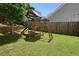 Backyard with a wooden playset, featuring a slide and climbing area for outdoor fun at 383 Crestbrook Ln, Dallas, GA 30157