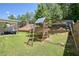 Backyard with a wooden playset and a swing set, perfect for outdoor fun at 383 Crestbrook Ln, Dallas, GA 30157