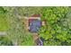 Aerial view of a charming home nestled among lush trees, offering privacy and a serene setting at 450 Collier Ridge Nw Dr, Atlanta, GA 30318