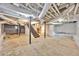 Unfinished basement space with exposed beams and utilities offers potential for customization at 450 Collier Ridge Nw Dr, Atlanta, GA 30318