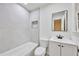 This bathroom offers a new vanity, mirror and updated tile work in shower at 450 Collier Ridge Nw Dr, Atlanta, GA 30318