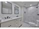 Bathroom featuring double vanity, marble tiled shower, and hexagon tiled floors at 450 Collier Ridge Nw Dr, Atlanta, GA 30318