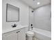 A renovated bathroom featuring new vanity, modern fixtures and updated subway tile in the shower at 450 Collier Ridge Nw Dr, Atlanta, GA 30318