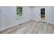 Bright room with a large window and hardwood floors that leads to a deck at 450 Collier Ridge Nw Dr, Atlanta, GA 30318
