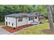 Exterior aerial view of a single-Gathering home featuring a new roof and a spacious front yard at 450 Collier Ridge Nw Dr, Atlanta, GA 30318