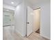 An open hallway features light colored wood flooring and a view of the front door at 450 Collier Ridge Nw Dr, Atlanta, GA 30318