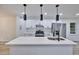Bright kitchen features quartz countertops, a large island, stainless steel appliances and new cabinets at 450 Collier Ridge Nw Dr, Atlanta, GA 30318