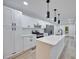 Bright kitchen features quartz countertops, a large island, stainless steel appliances and new cabinets at 450 Collier Ridge Nw Dr, Atlanta, GA 30318
