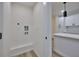 A convenient laundry area is located adjacent to the kitchen at 450 Collier Ridge Nw Dr, Atlanta, GA 30318