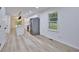Open-concept living area with lots of natural light and durable new flooring at 450 Collier Ridge Nw Dr, Atlanta, GA 30318