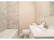 Bathroom featuring a sleek vanity and shower tub combo at 1207 Ellington Dr, Morrow, GA 30260