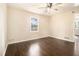 Bedroom featuring hardwood flooring, a ceiling fan, and neutral paint at 1207 Ellington Dr, Morrow, GA 30260