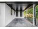 This outdoor covered patio boasts custom iron posts and access to the main home at 1207 Ellington Dr, Morrow, GA 30260