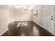 Living room with hardwood flooring, paneled walls, and coffered ceilings at 1207 Ellington Dr, Morrow, GA 30260