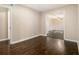 Living room featuring hardwood flooring, a spacious open layout, and neutral paint at 1207 Ellington Dr, Morrow, GA 30260