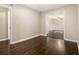 Spacious room showcasing dark hardwood floors and an open entrance at 1207 Ellington Dr, Morrow, GA 30260
