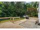 This house has a spacious backyard with a wooden deck, a lush lawn, and mature trees for privacy at 4255 Hidden Meadow Circle, Sugar Hill, GA 30518