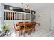 Eat-in kitchen with tile flooring and a view of the living room and stairs, creating an open feel at 4255 Hidden Meadow Circle, Sugar Hill, GA 30518