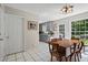 Eat-in kitchen with tile flooring, lots of natural light, and a table with seating for six at 4255 Hidden Meadow Circle, Sugar Hill, GA 30518