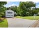 Charming two-story home with a well-manicured lawn and a spacious driveway leading to a two-car garage at 4255 Hidden Meadow Circle, Sugar Hill, GA 30518
