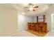 Finished basement with wet bar featuring wood counter, tile flooring, and recessed lighting at 4610 Admiral Ridge Way, Lilburn, GA 30047