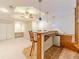 Basement area featuring wet bar, tile flooring, cabinetry, a ceiling fan, and recessed lighting at 4610 Admiral Ridge Way, Lilburn, GA 30047