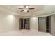 Finished basement area features neutral carpet, custom built-in bookcases, and recessed lighting at 4610 Admiral Ridge Way, Lilburn, GA 30047