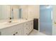 Bathroom featuring double sink vanity with white tile flooring at 4610 Admiral Ridge Way, Lilburn, GA 30047