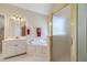 Bathroom features a vanity, soaking tub, and separate shower with glass door at 4610 Admiral Ridge Way, Lilburn, GA 30047