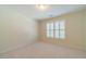 Neutral bedroom features carpet and a window with modern shutter at 4610 Admiral Ridge Way, Lilburn, GA 30047