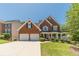 Charming two-story brick home with a well-manicured lawn and two-car garage at 4610 Admiral Ridge Way, Lilburn, GA 30047