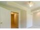 This hallway has neutral walls, carpeting and an open doorway at 4610 Admiral Ridge Way, Lilburn, GA 30047