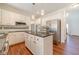 Spacious kitchen featuring stainless steel appliances, granite countertops, and ample cabinet space at 4610 Admiral Ridge Way, Lilburn, GA 30047