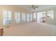 Open floor plan with living room view into the kitchen area and bright windows at 4610 Admiral Ridge Way, Lilburn, GA 30047