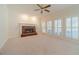 Spacious living room with a brick fireplace and bright windows for ample light at 4610 Admiral Ridge Way, Lilburn, GA 30047